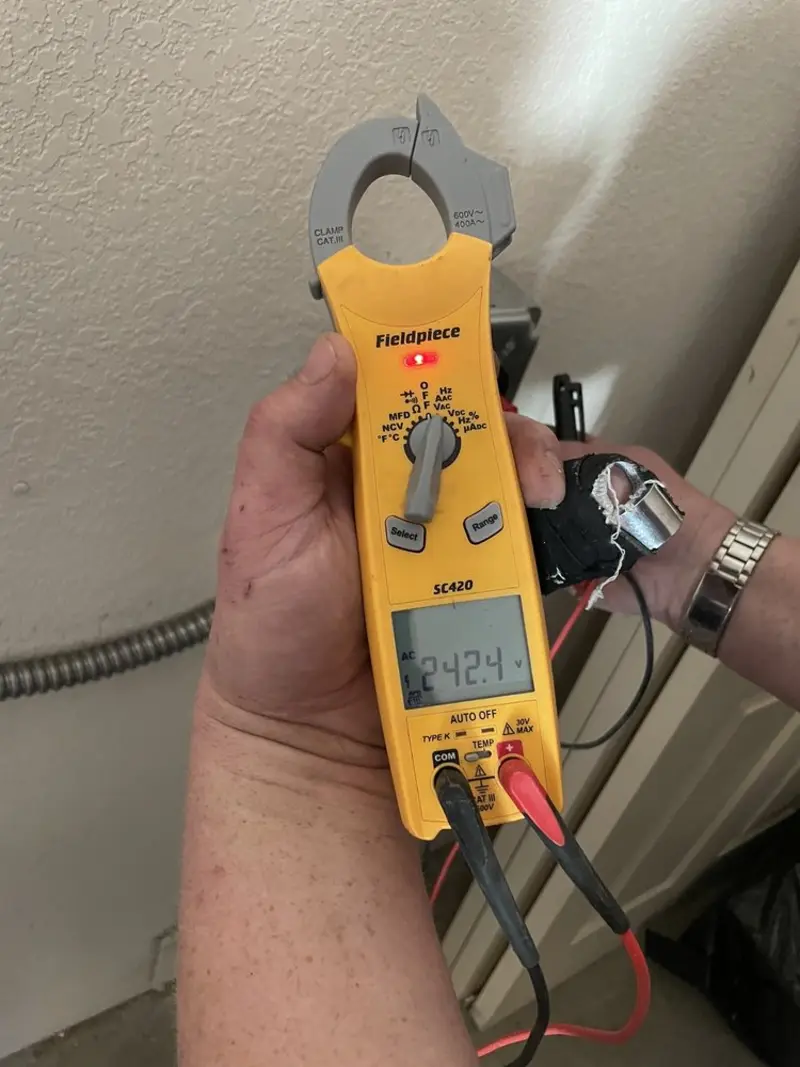 Voltage testing with clamp meter during Generator Installation in Marshfield